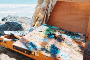 A canvas with many different colors mixed together.