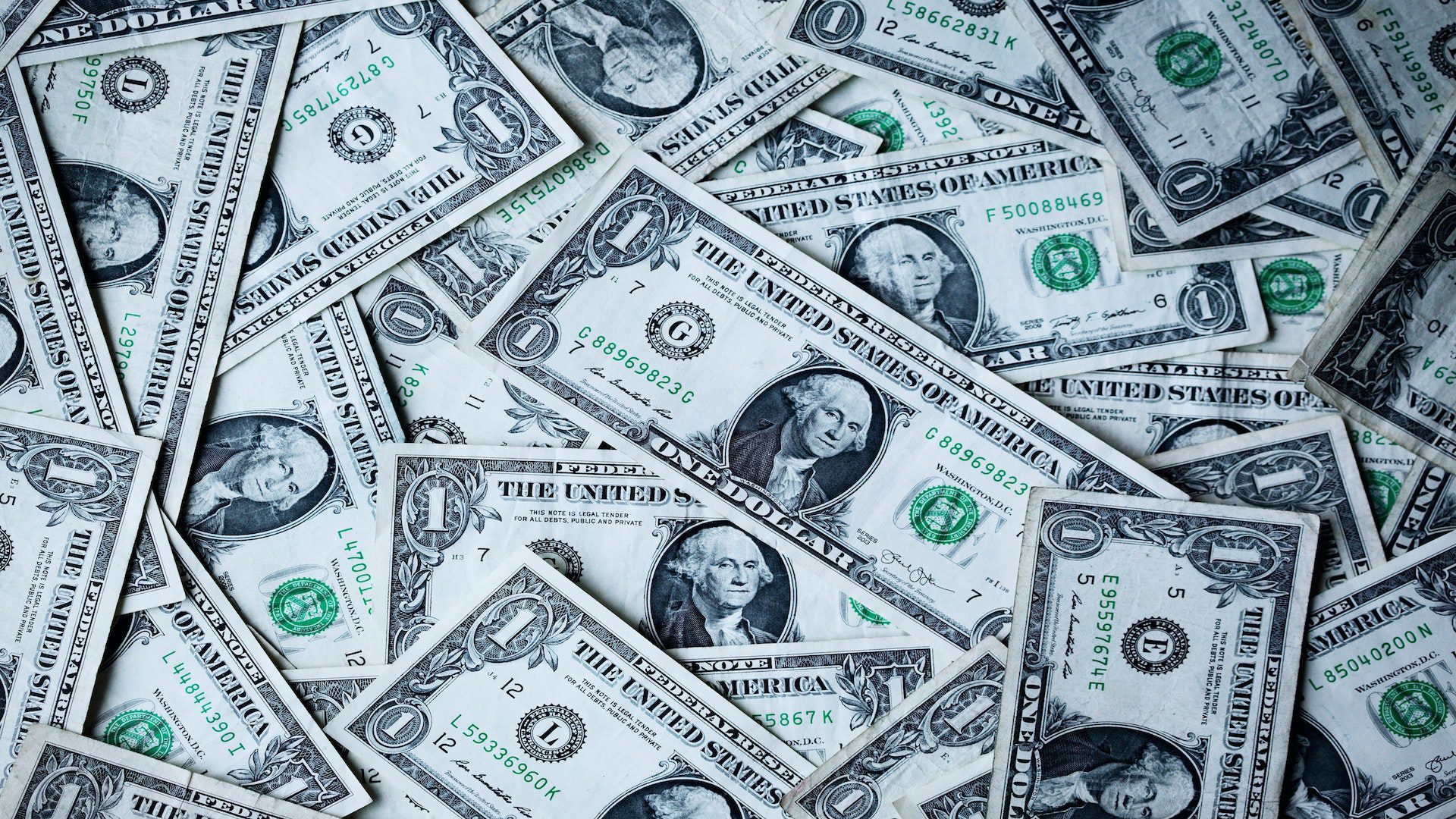 A pile of one dollar bills.