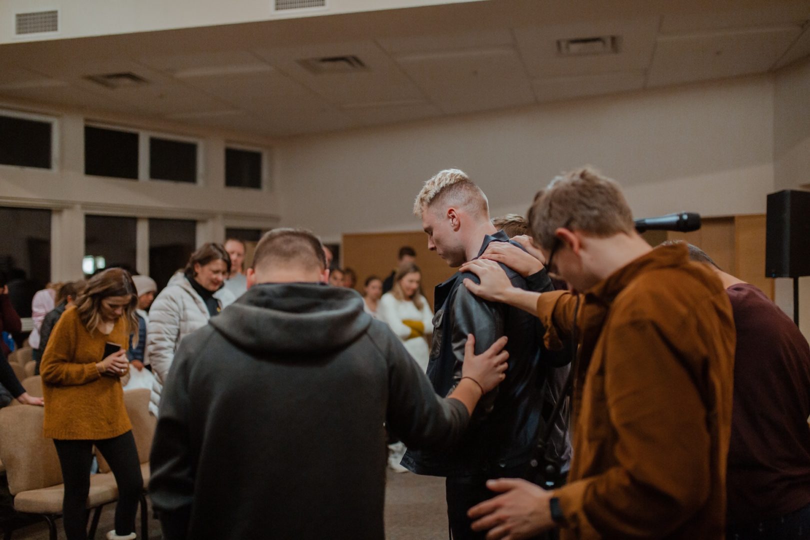 What do deacons do? In this article, David Platt makes a Biblical case for what deacons do. In this image, men in the church lay hands on a new man who is being presented as a deacon in the congregation.