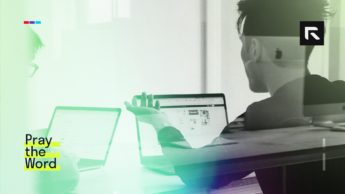A man sits at his computer and works for the Lord.