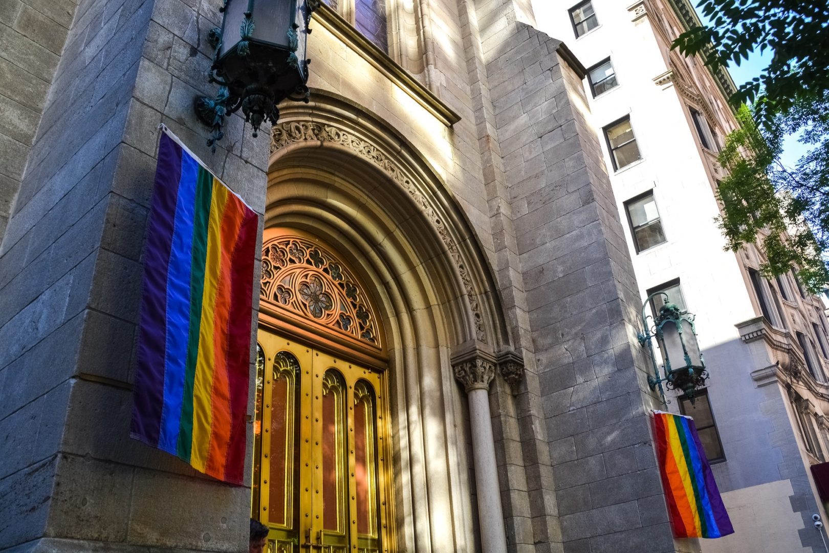 Gay flags hang from the outside of a New York City church. In this article, David Platt explains why Christians can't affirm homosexuality.