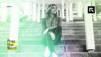 A woman sits on the steps while faithfully suffering.