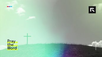 A cross appears in the background on a small grassy hill.