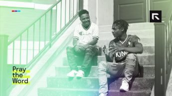 Two men sit and talk about the gospel on the stairs.