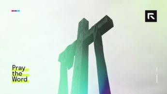 Red fabric hangs over the cross.