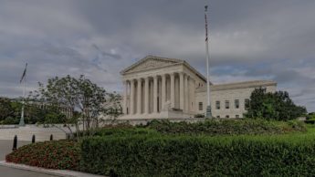 An American flag flies outside of the Supreme Court of the United States.