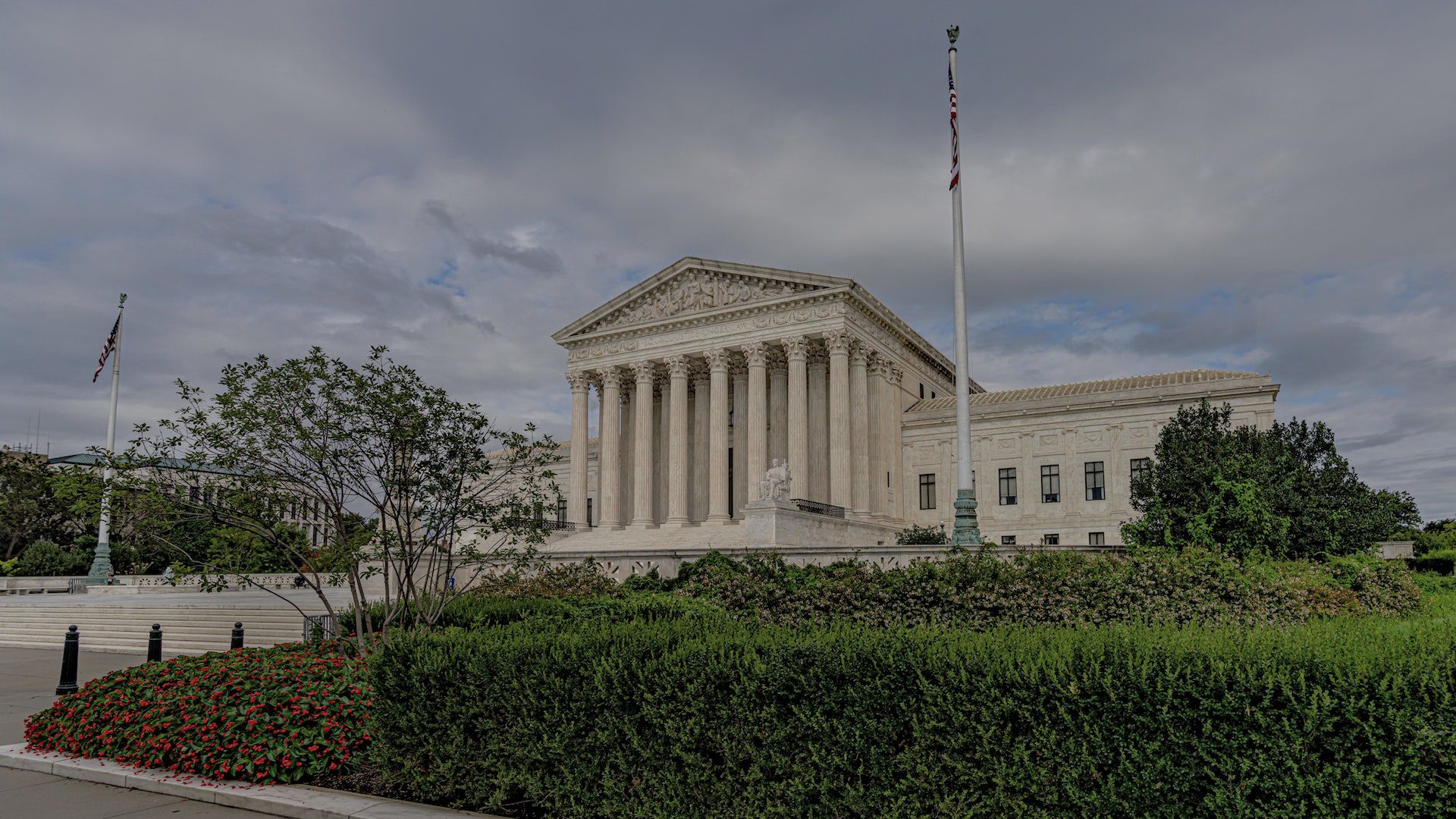 An American flag flies outside of the Supreme Court of the United States.