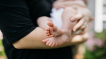 Man holding a baby.