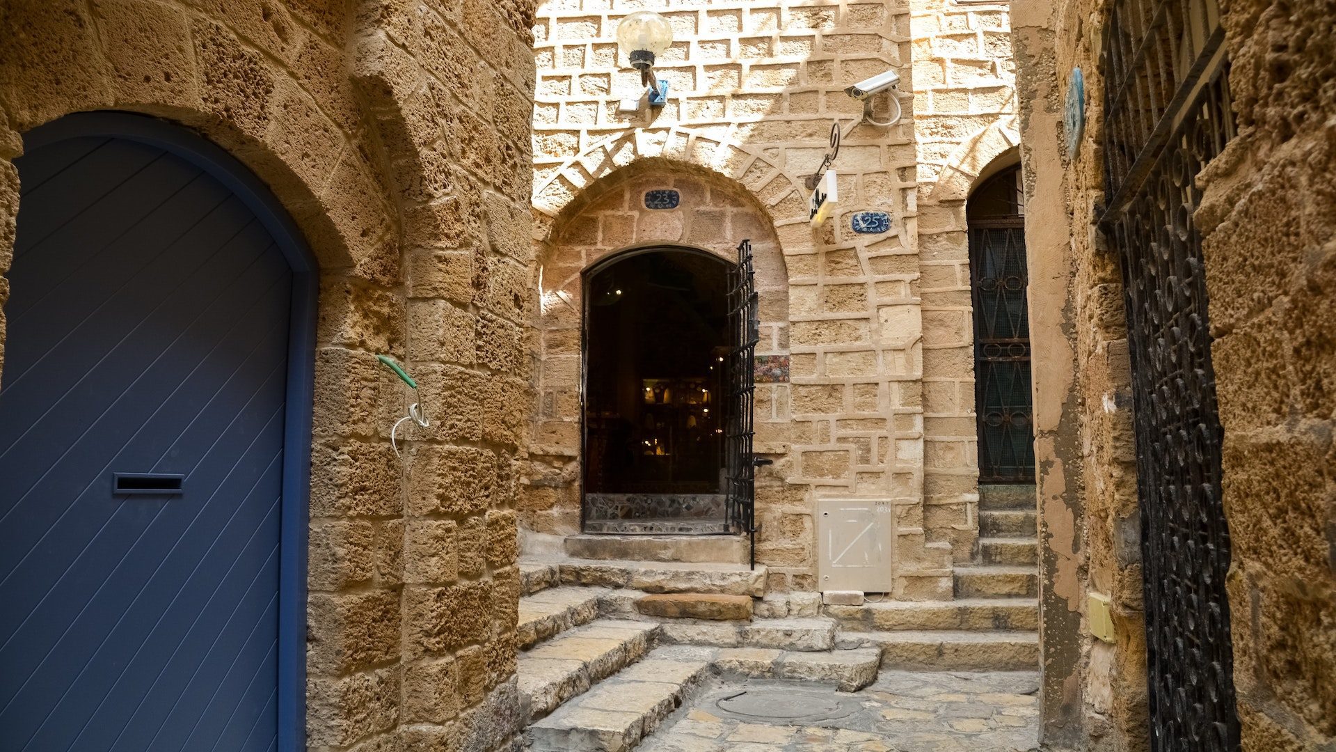 Brown, stone buildings with a blue door.