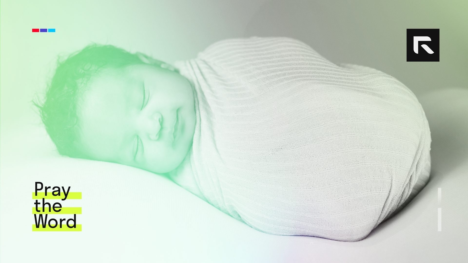 A small baby in a white sweater.