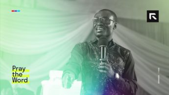 An African preacher speaks to a congregation.