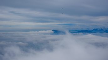 Clouds over blue mountains.