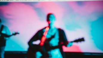 Man playing a guitar.