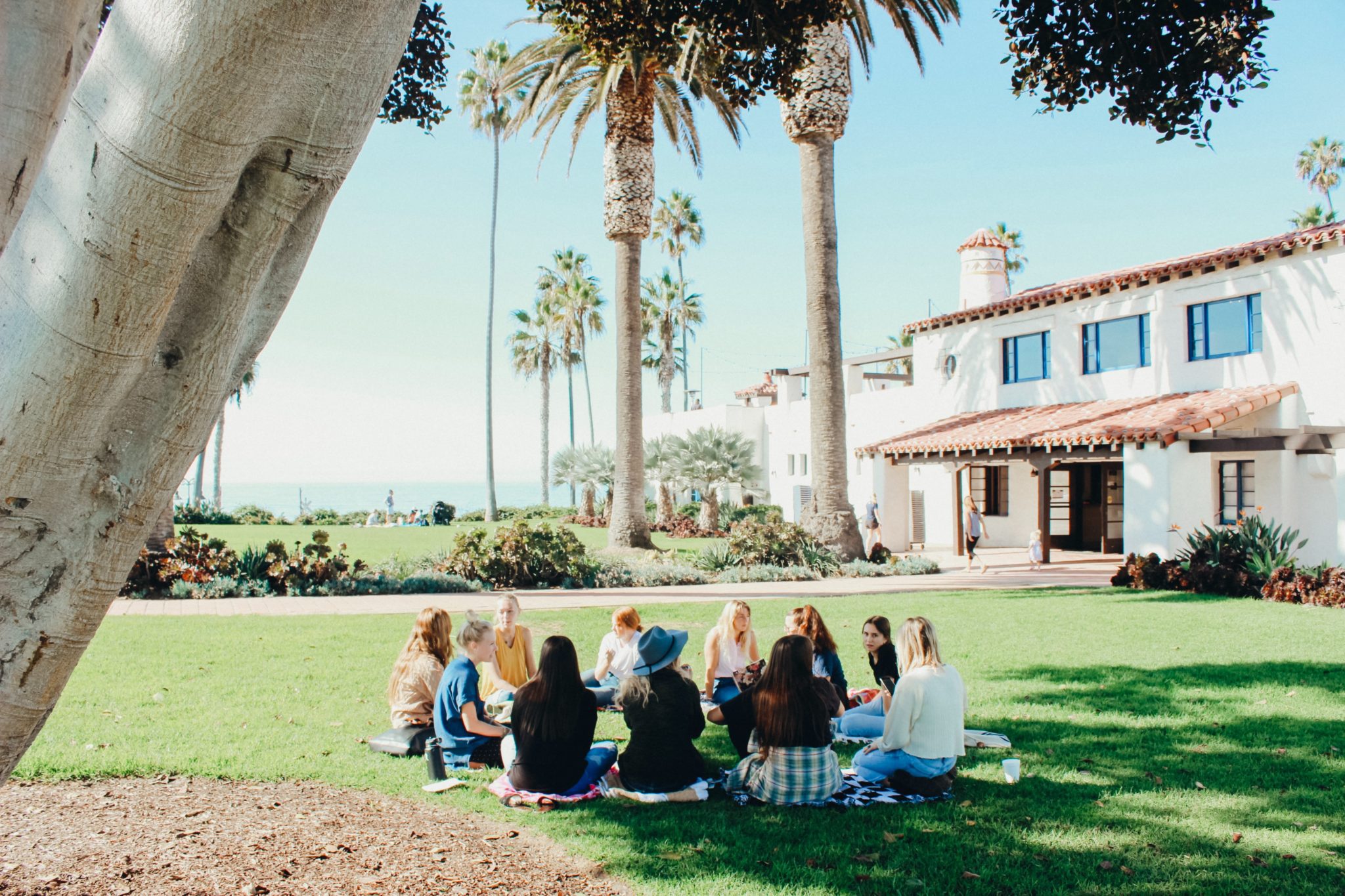 Students sit on a California college campus.