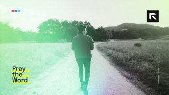 A man walks down a path.