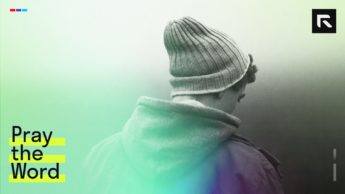man with knit cap on grey background