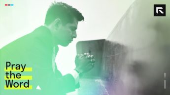 Man kneeling closing his eyes and praying
