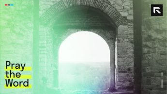 brown brick arch near body of water during daytime