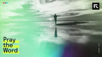 silhouette of a person standing on a rock surrounded by body of water