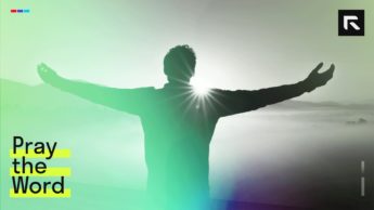 silhouette of man raising his hands in worship during sunset