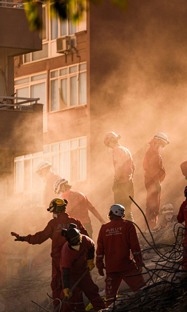 Rescuers in red help survivors during the Syria-Turkey earthquake in 2023.