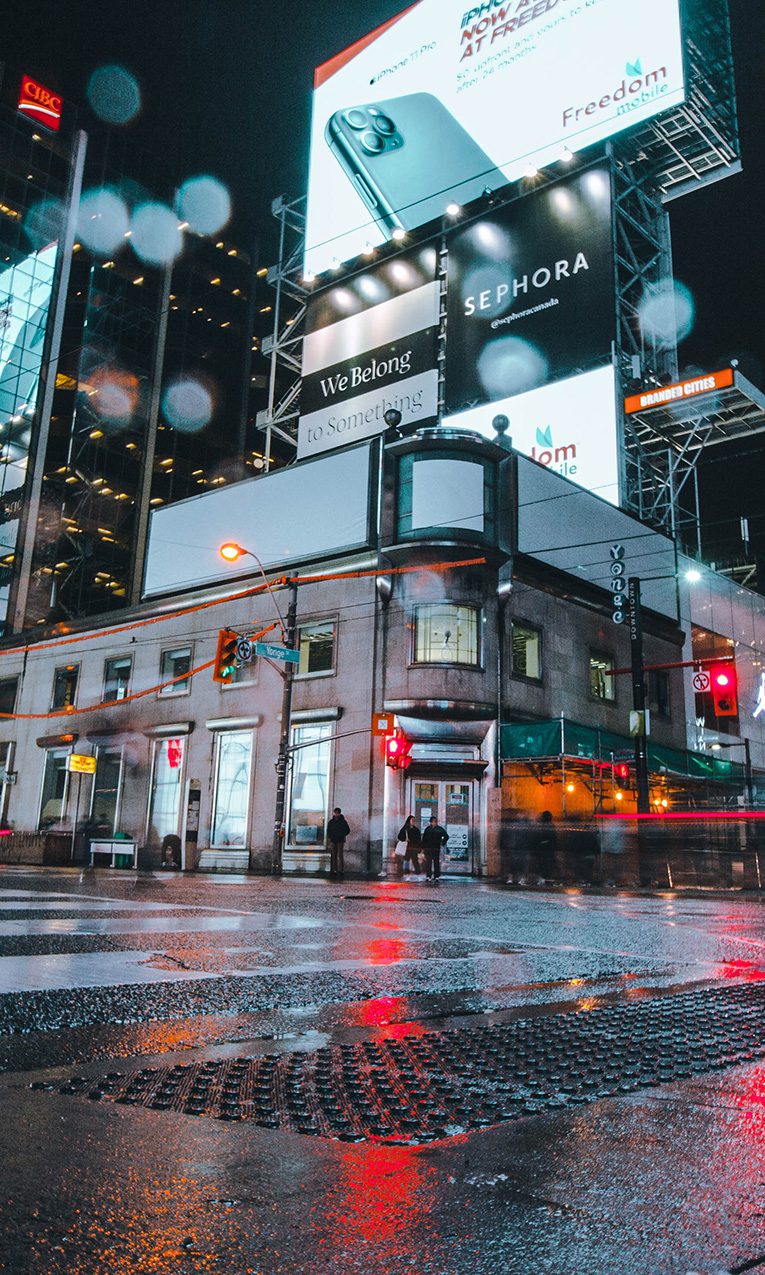 people walking on the streets of Canada at night