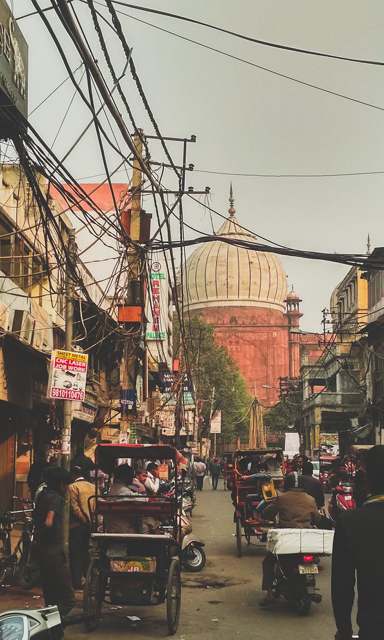 people walking on the street near the Jama Masjid of Delhi, one of the largest mosques in India