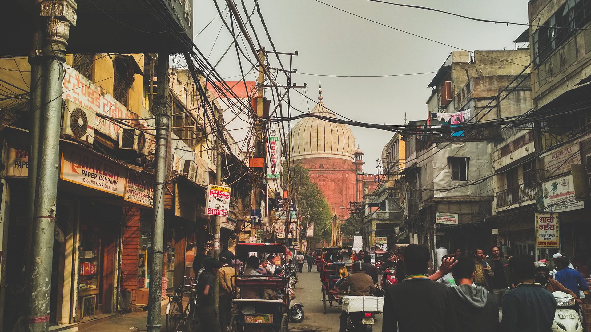 people walking on the street near the Jama Masjid of Delhi, one of the largest mosques in India