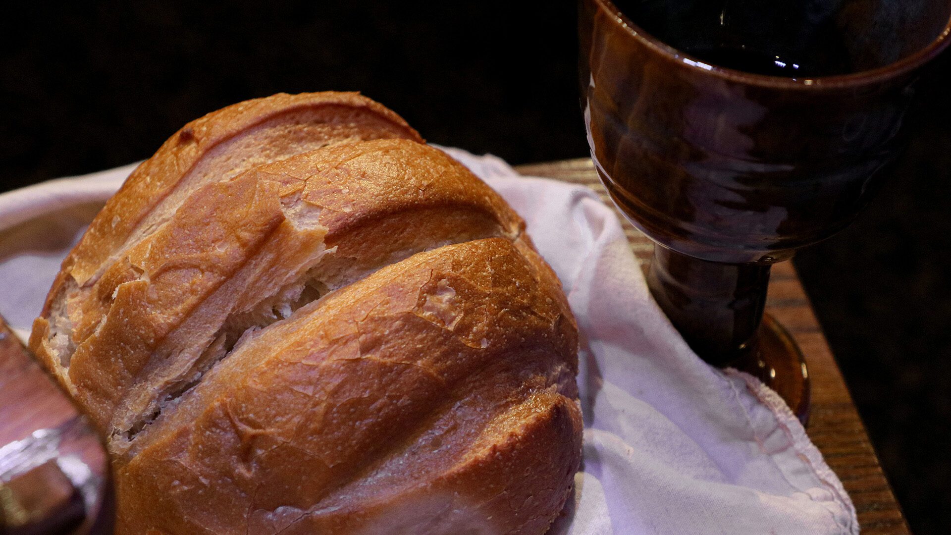 bread and wine set on a table