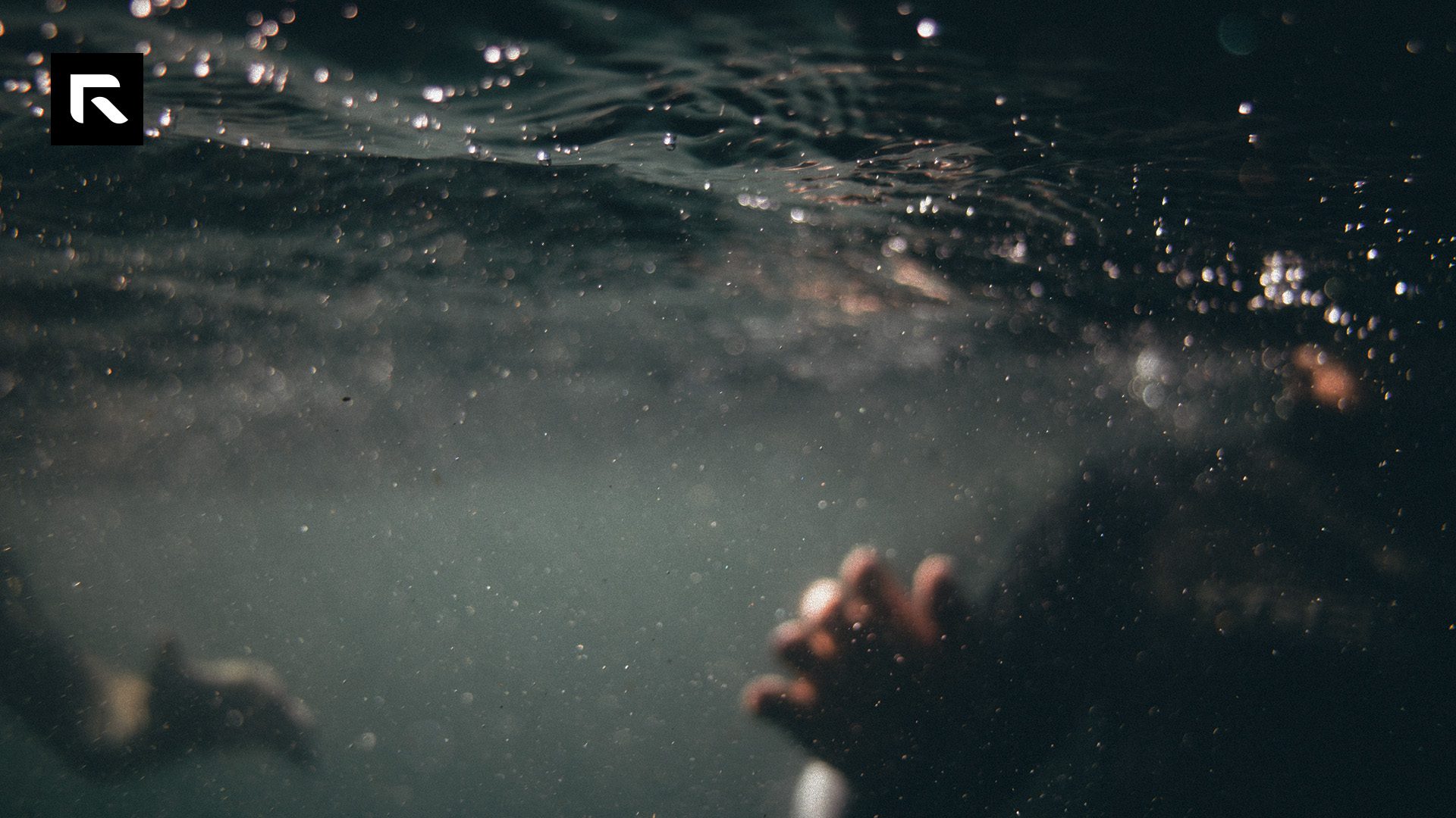 hand underwater reaching out
