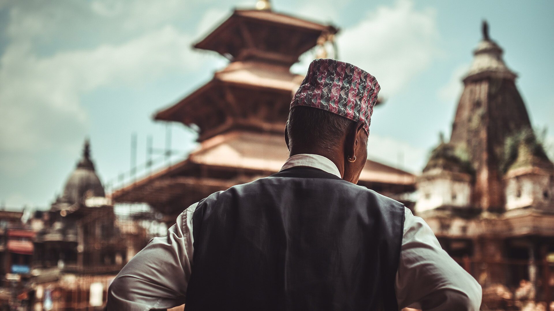 man in black suit jacket in Patan, Nepal