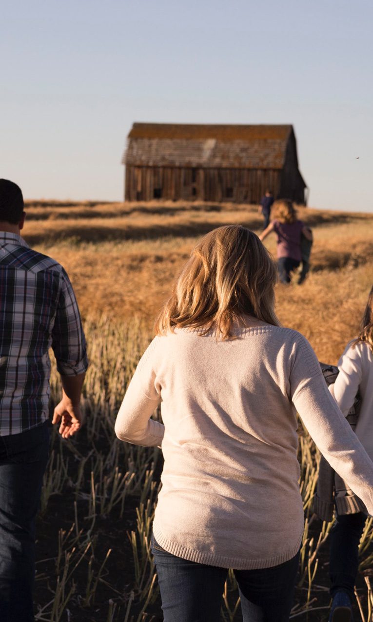 a family walking in a field