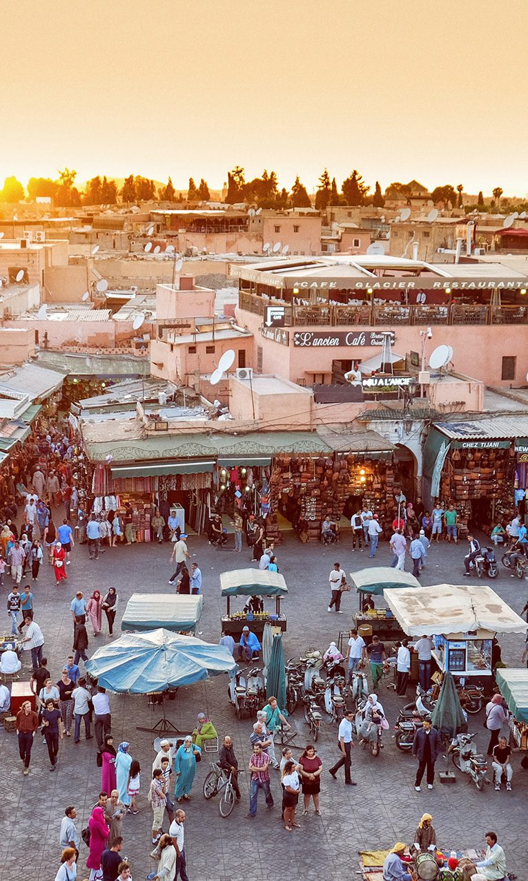 people walking in Marrakech market in Morocco
