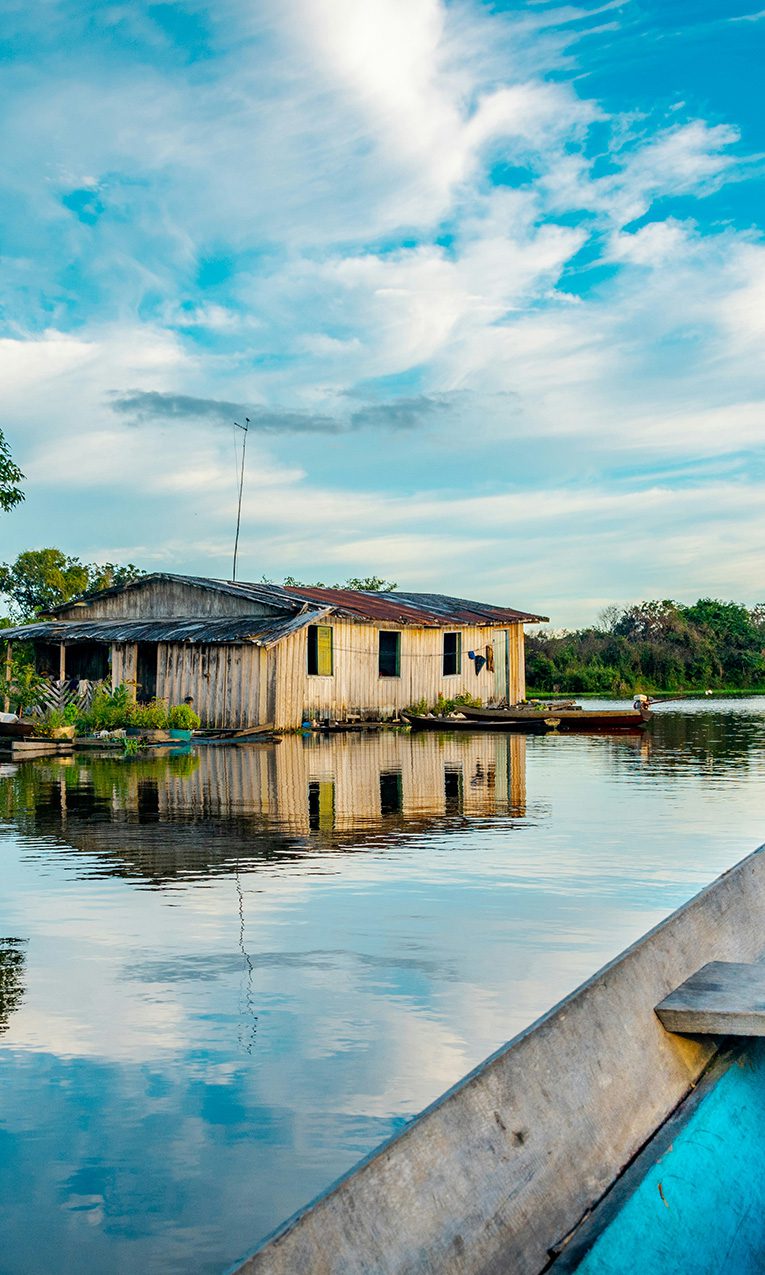a wooden house built near the Amazon River