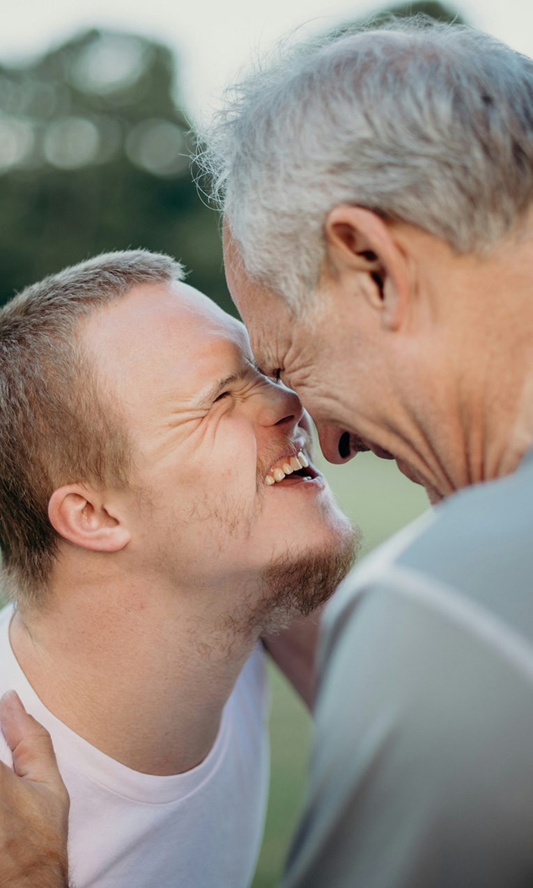 a man hugging his son