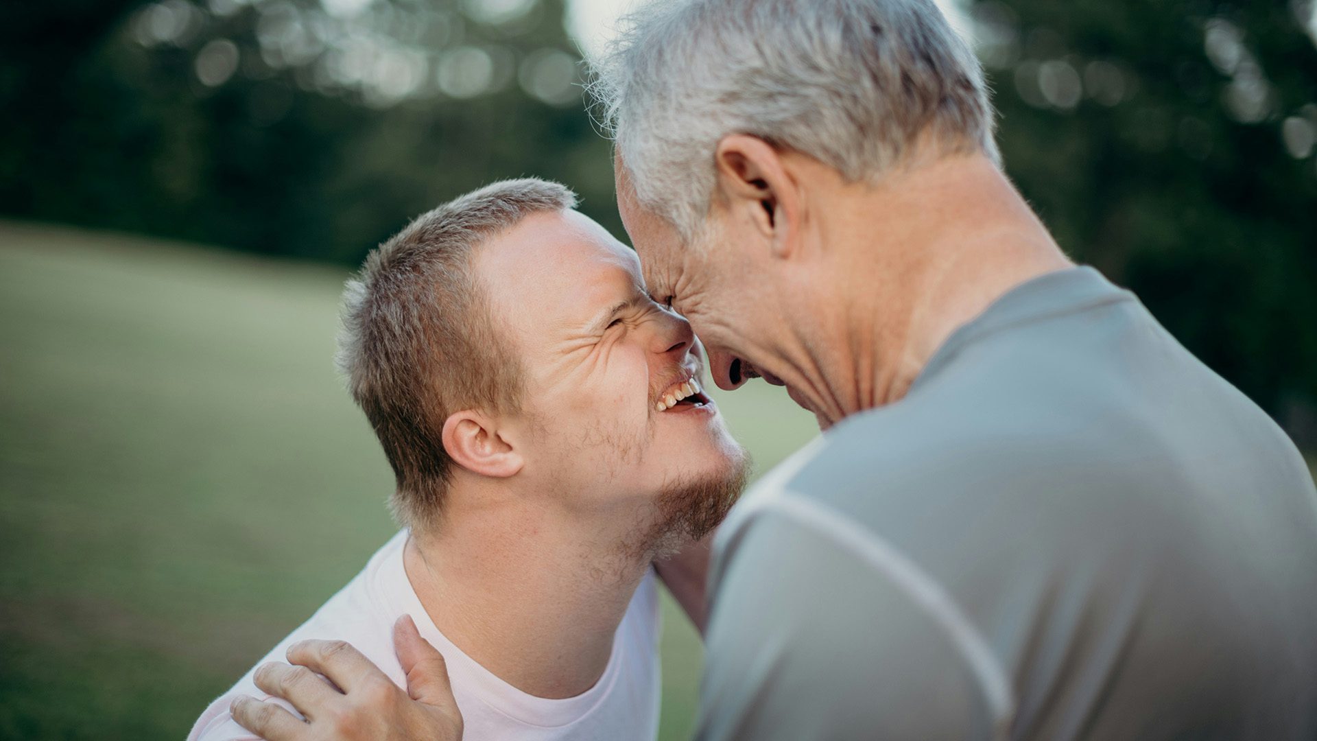 a man hugging his son