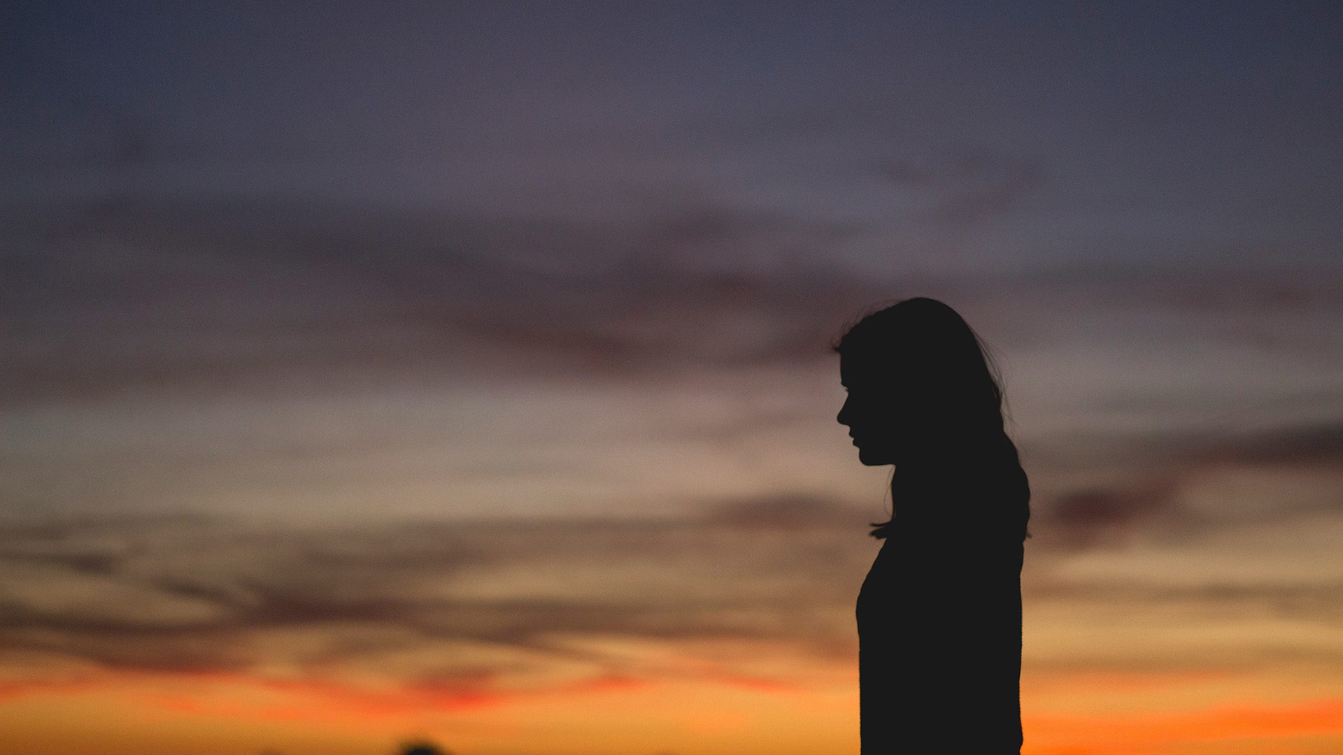 silhouette of a woman during sunset