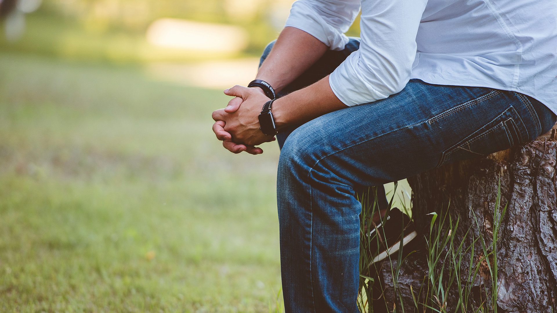 a man with hands folded in prayer