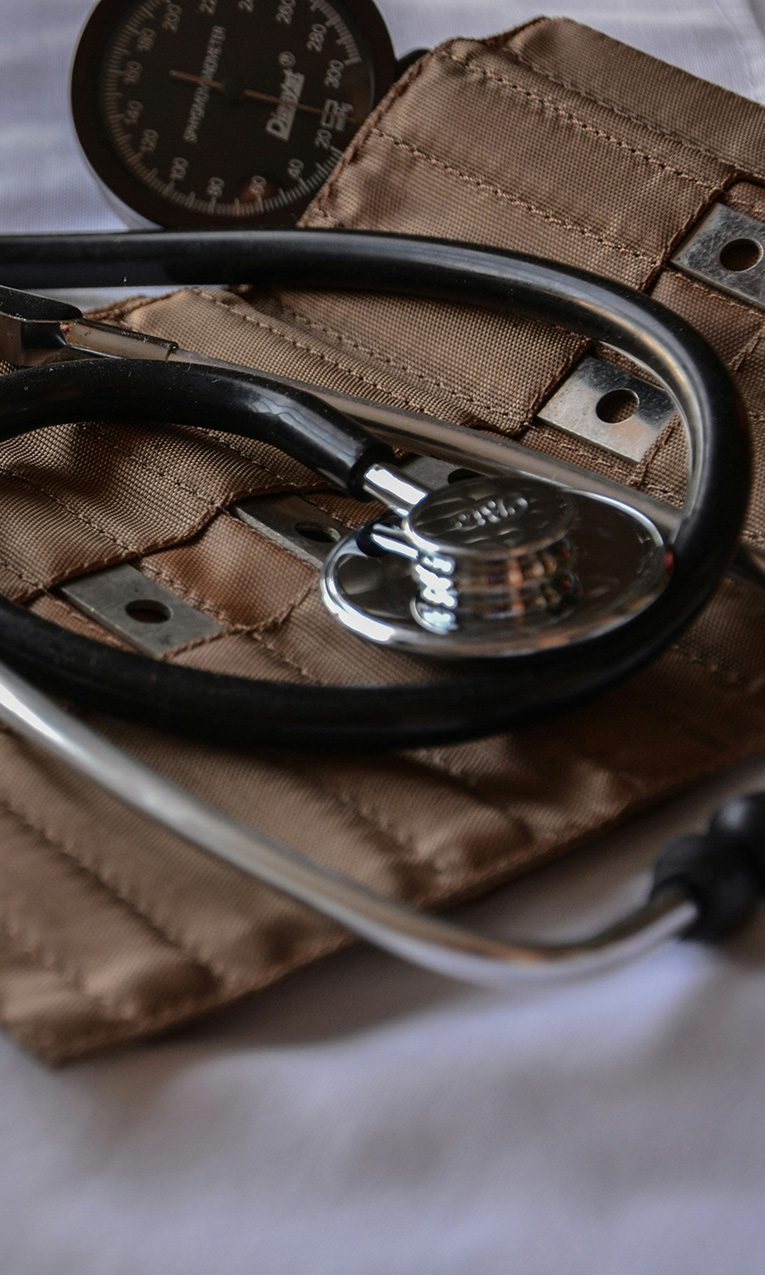 black stethoscope with brown leather case
