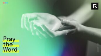 two hands stretched out in worship