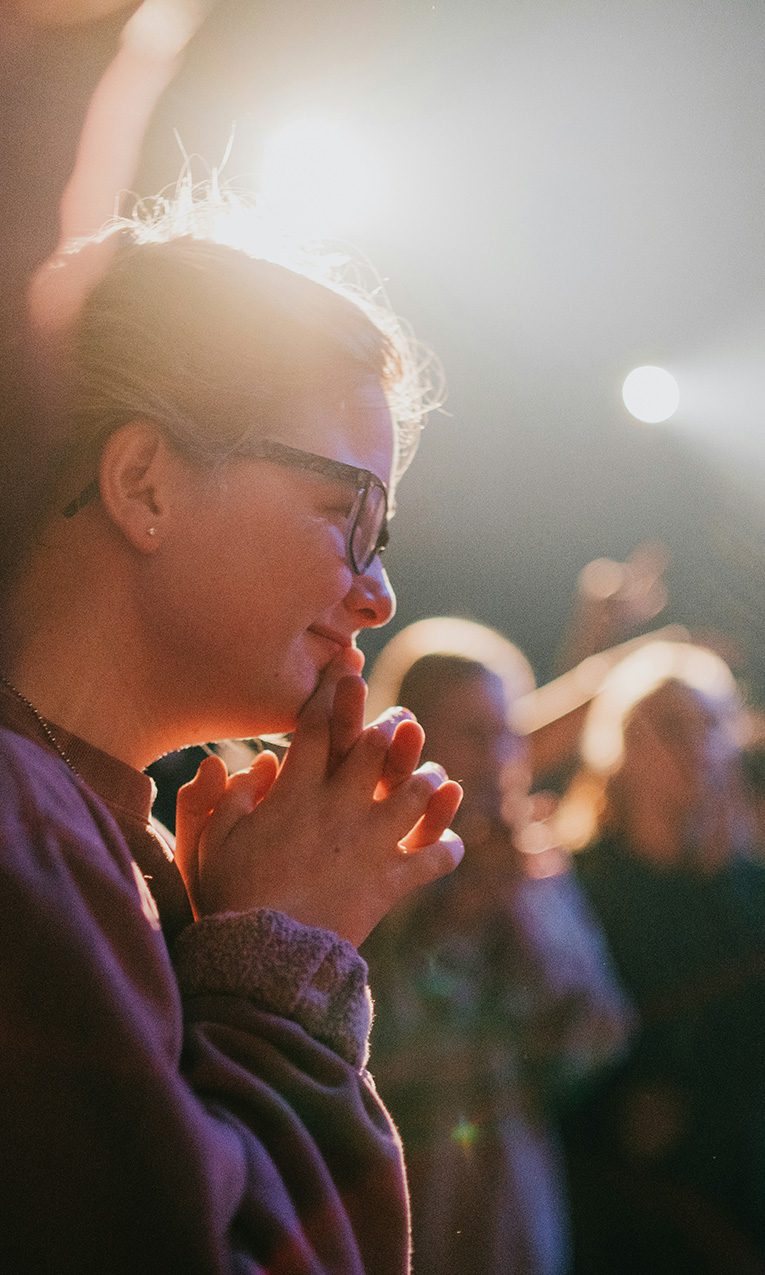a woman smiling during Sunday service