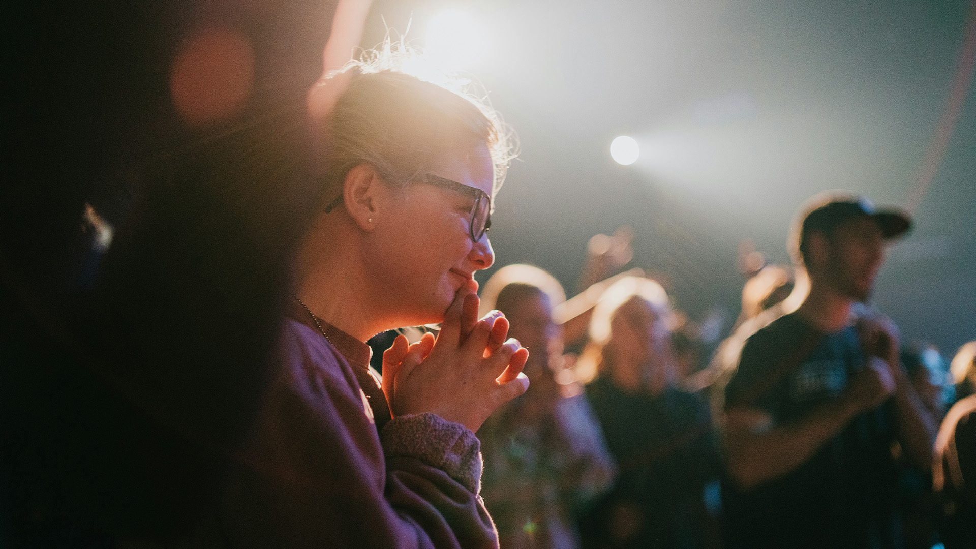 a woman smiling during Sunday service
