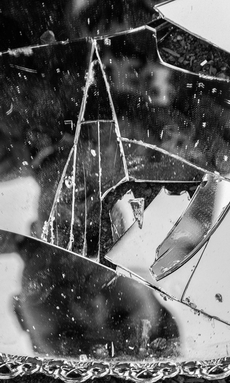a broken mirror on the floor