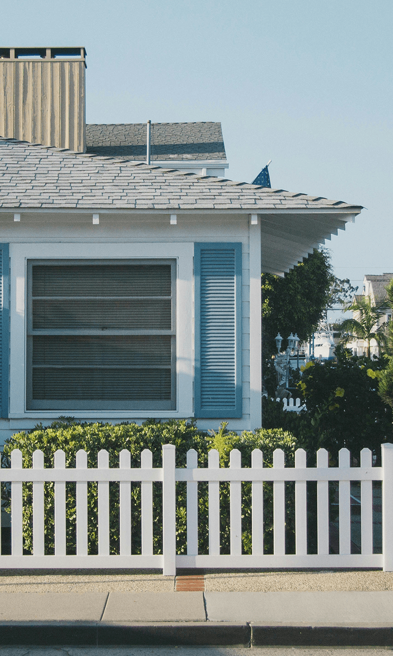 a house with a white picket fence