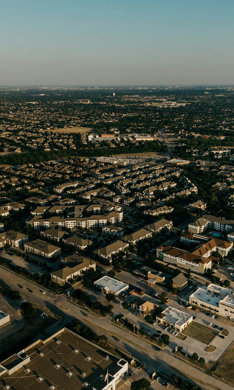 an aerial view of a city with lots of buildings