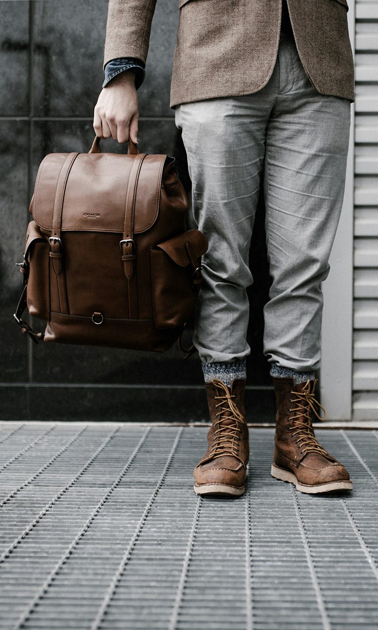 a man holding a backpack