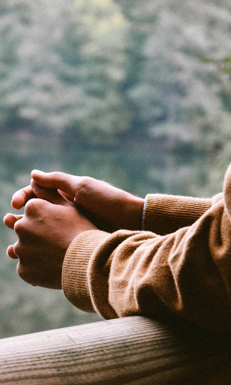 a man in a brown jacket