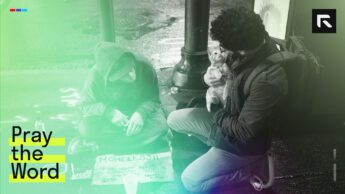 a young man helping a homeless man