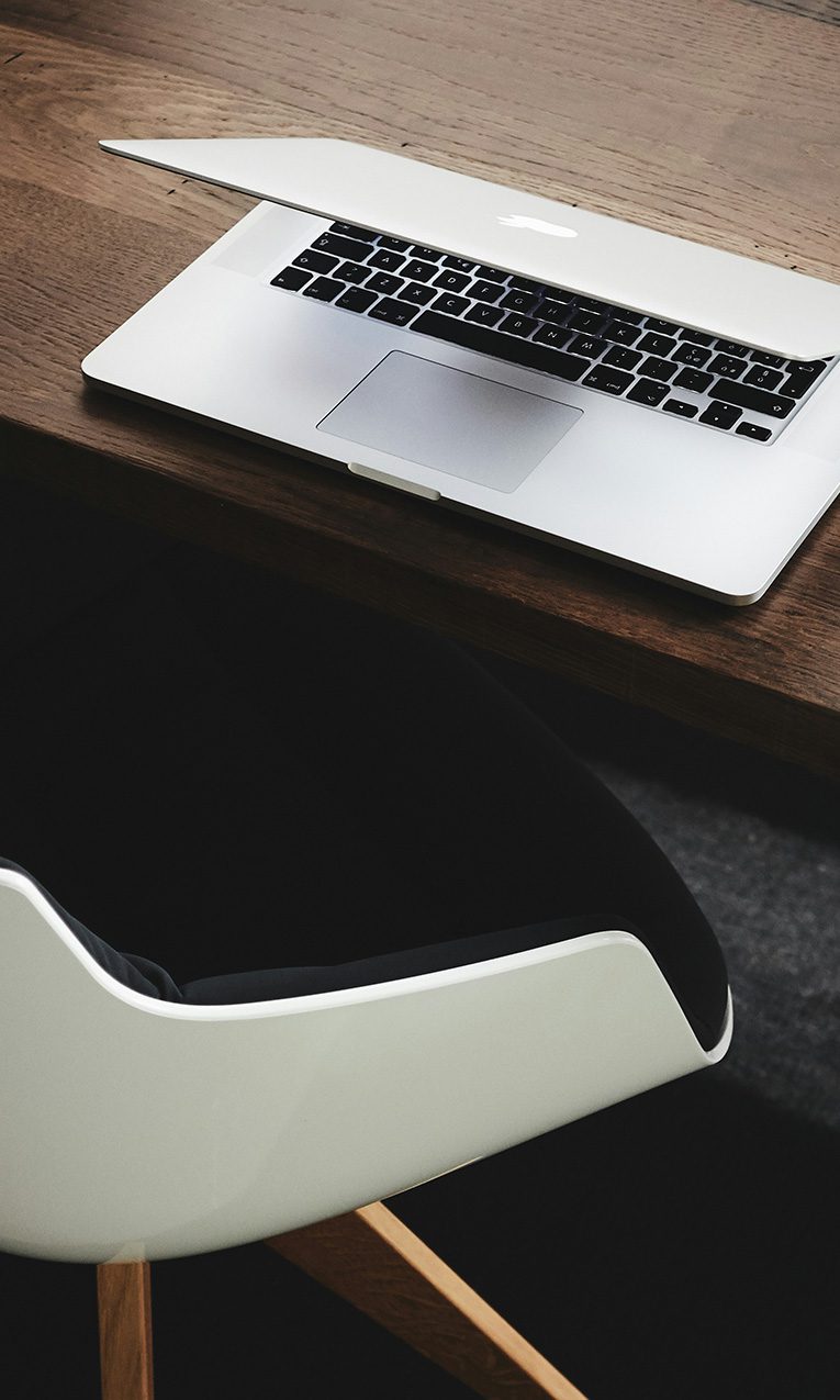 Laptop and mouse at an office desk