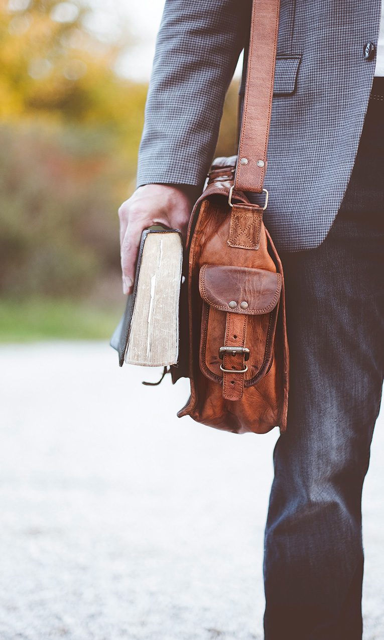 A pastor holding a Bible.